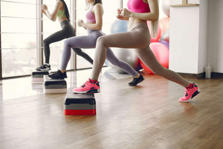 Girls train in gym in sports uniformの写真素材