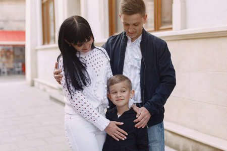 Cute family playing in a summer cityの写真素材
