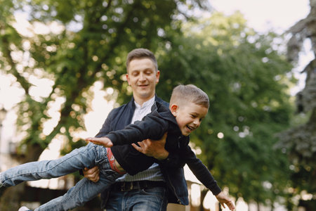 Cute family playing in a summer park