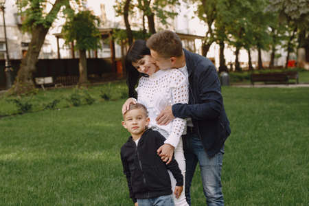 Cute family playing in a summer parkの写真素材