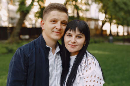 Beautiful couple spend time on a summer parkの写真素材