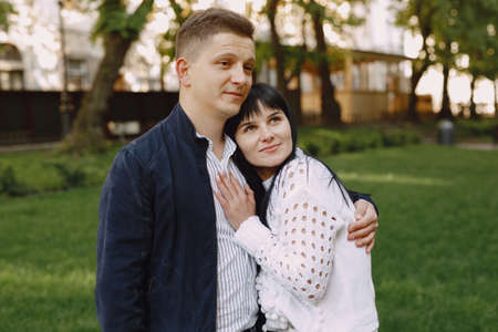 Beautiful couple spend time on a summer parkの写真素材