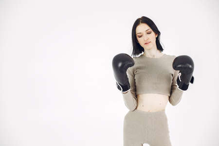 Girl with sports equipment on a white backgroundの写真素材
