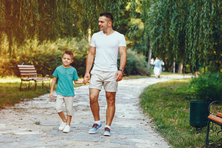 Cute family playing in a summer fieldの写真素材