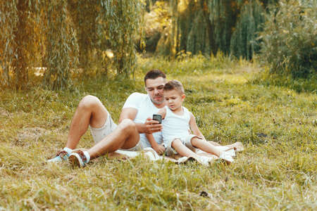 Cute family playing in a summer fieldの写真素材
