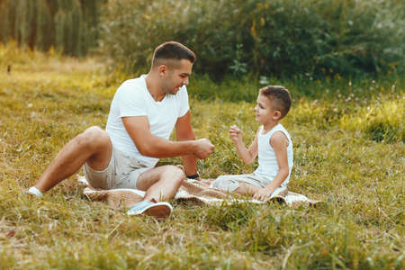 Cute family playing in a summer fieldの写真素材