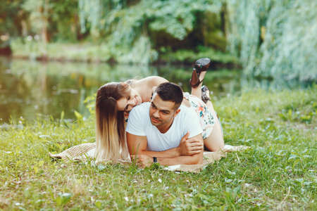 Beautiful couple spend time on a summer fieldの写真素材