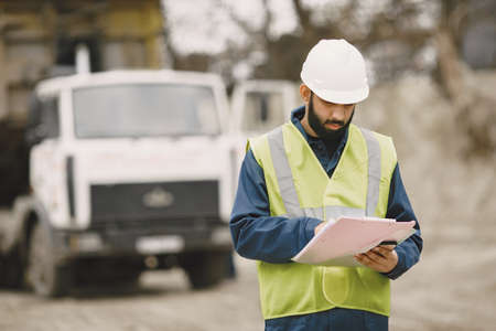 Civil engineer working outside with helmet