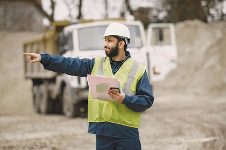 Civil engineer working outside with helmet