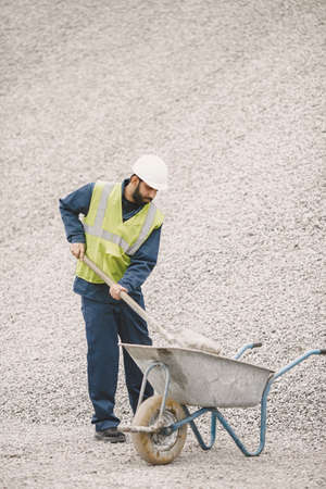 Civil engineer working outside with helmetの写真素材