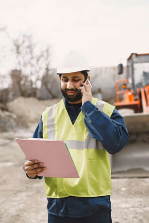 Civil engineer working outside with helmet