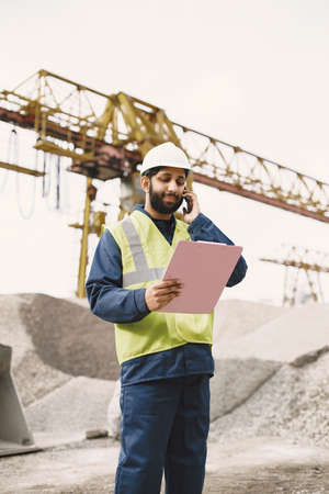 Civil engineer working outside with helmet