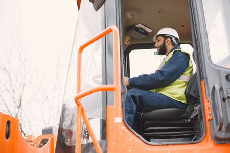 Civil engineer working outside with helmetの写真素材