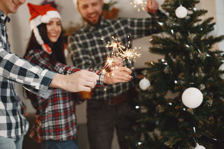 Young people celebrating New Year at home partyの写真素材