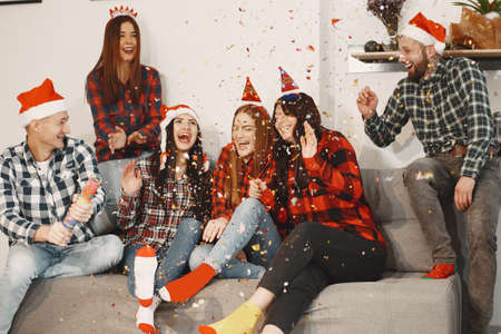 Young people celebrating New Year at home partyの写真素材