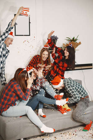 Young people celebrating New Year at home partyの写真素材