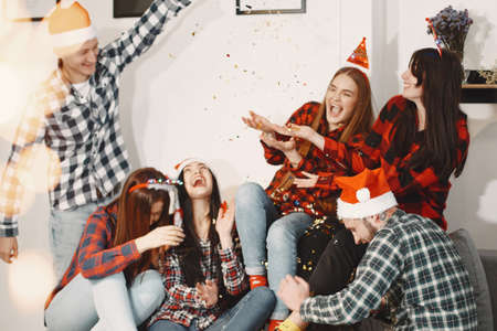 Young people celebrating New Year at home party