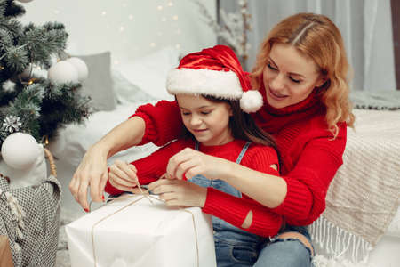 Mother with little daughter at homeの写真素材