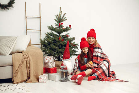 Mother with little daughter at homeの写真素材