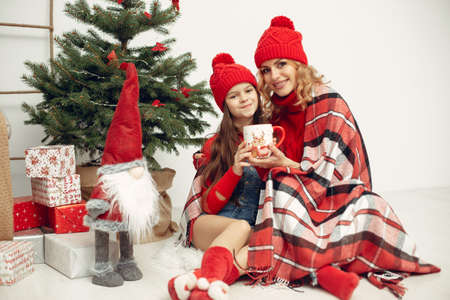 Mother with little daughter at homeの写真素材