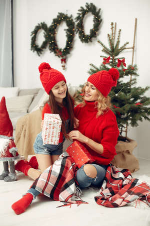 Mother with little daughter at homeの写真素材