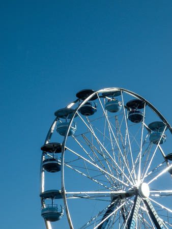 White Ferris Wheel and a blue sky backgroundの写真素材