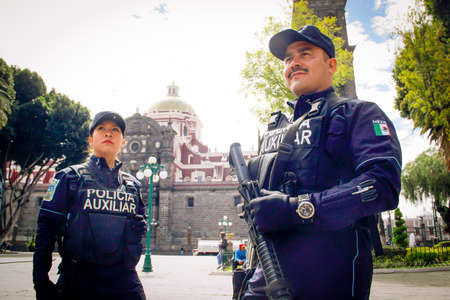 Mexican agents of the Puebla State Police watching during the Covid-19 coronavirus contingencyのeditorial素材