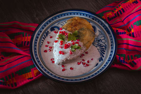 Chile en Nogada in a talavera plate from Puebla, traditional cuisine of Mexicoの写真素材