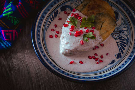 Chile en Nogada in a talavera plate from Puebla, traditional cuisine of Mexicoの写真素材