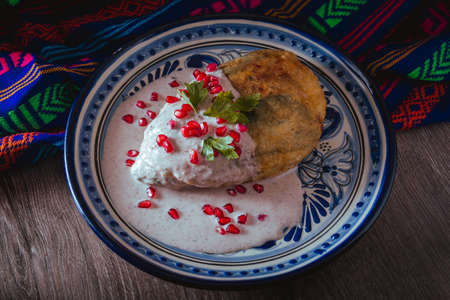 Chile en Nogada in a talavera plate from Puebla, traditional cuisine of Mexicoの写真素材