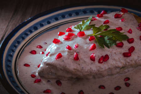 Chile en Nogada in a talavera plate from Puebla, traditional cuisine of Mexicoの写真素材