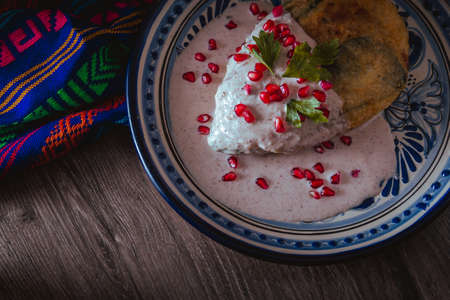 Chile en Nogada on a talavera plate from Puebla, traditional cuisine of Mexicoの写真素材