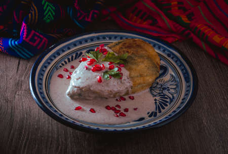Chile en Nogada on a talavera plate from Puebla, traditional cuisine of Mexicoの写真素材