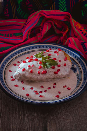 Chile en Nogada on a talavera plate from Puebla, traditional cuisine of Mexicoの写真素材