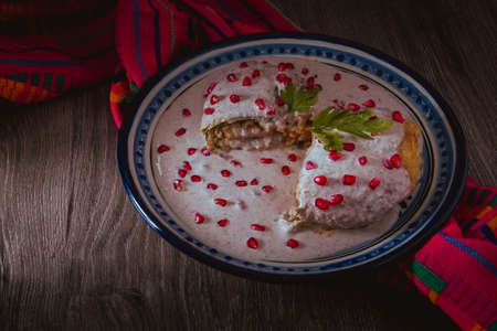 Chile en Nogada on a talavera plate from Puebla, traditional cuisine of Mexicoの写真素材