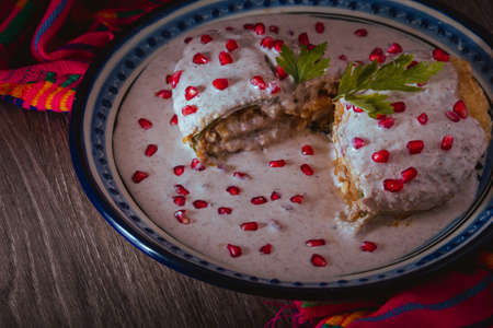 Chile en Nogada on a talavera plate from Puebla, traditional cuisine of Mexicoの写真素材