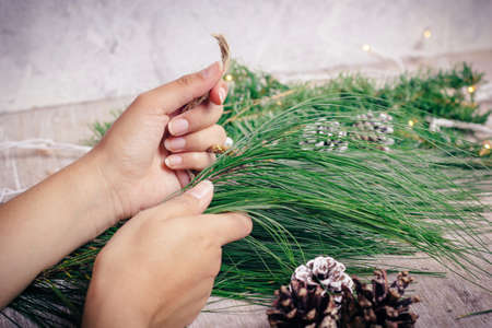 Mini christmas gifts on wooden background with warm and cold tonesの写真素材