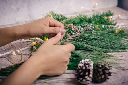 Mini christmas gifts on wooden background with warm and cold tonesの写真素材