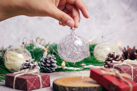 Mini christmas gifts on wooden background with warm and cold tonesの写真素材