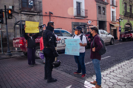 Citizen groups demonstrate against the increase in drinking water rates in Puebla in front of the State Congressのeditorial素材