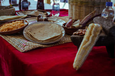 Wrapped with Mole from San Lucas Atzala, Puebla with red corn tortilla