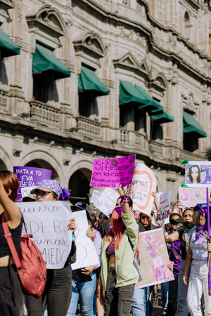 Protests in the streets of the city of Puebla during the march for women's rights, feminist march against gender violence, March 8 in the City of Pueblaのeditorial素材