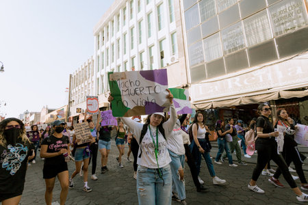 Protests in the streets of the city of Puebla during the march for women's rights, feminist march against gender violence, March 8 in the City of Pueblaのeditorial素材
