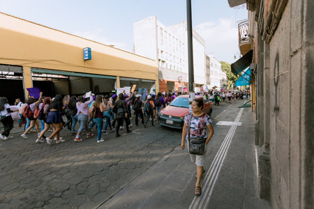 Protests in the streets of the city of Puebla during the march for women's rights, feminist march against gender violence, March 8 in the City of Pueblaのeditorial素材