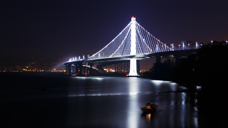 New span of the San Francisco-Oakland Bay Bridge illuminated at nightの写真素材