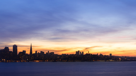 San Francisco skyline at sunset with dramatic cloudsの写真素材