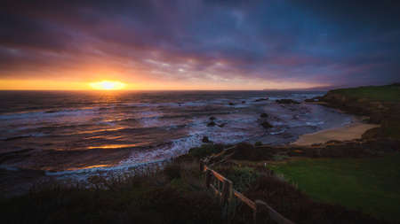 Dramatic sunset at Half Moon Bay beach, Californiaの写真素材