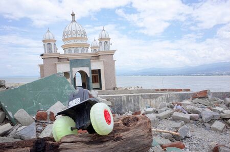 PALU, INDONESIA - OCTOBER 11th, 2018: A partially submerged mosque that has been knocked off its...