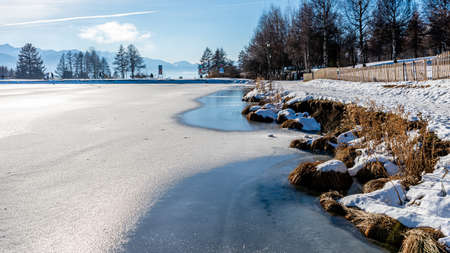 Winter landscape with river and snow in Crans Montana in Switzerland. Tranquil scene. Cold and frozen.の写真素材