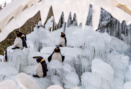 Ice crystals. Icicles with penguin toys. Fribourg, Switzerland.